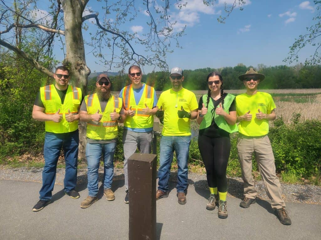 Barry Isett & Associates volunteers clean up litter along Industrial Road by HACC Harrisburg Campus and Wildwood Park in Harrisburg.