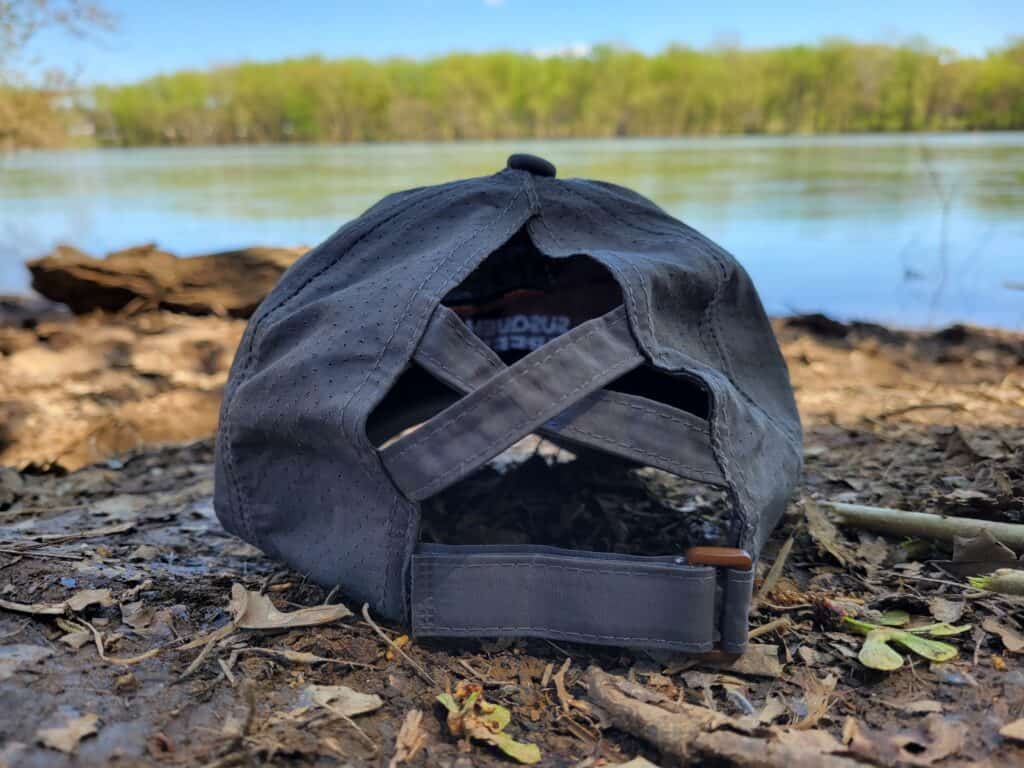 gray hat on river shore