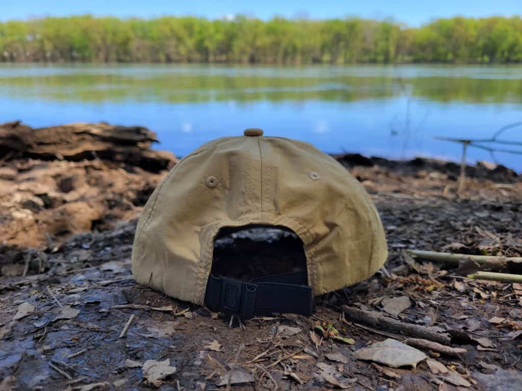 tan hat on river shore