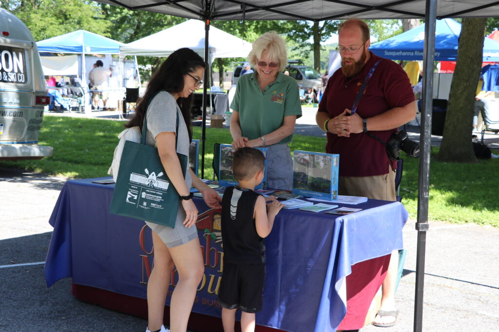 Guests meet a vendor at the Outdoor Expo