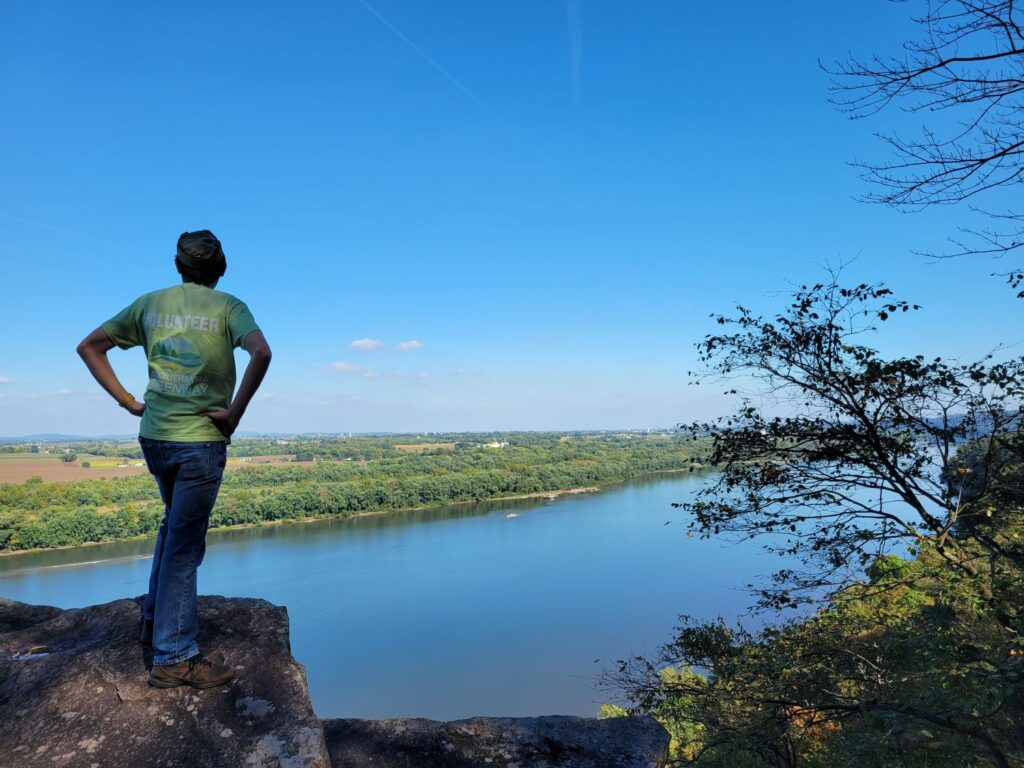 overlook of a river with person looking out