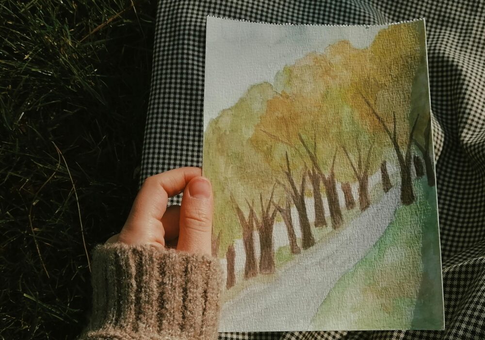 Someone holds a drawing of an outside trail.